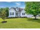 Beautiful home with a well-manicured lawn and mature trees creating an inviting curb appeal at 5016 Swordfish Dr, Raleigh, NC 27603