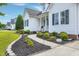 Beautiful home showcasing a manicured walkway, leading to a cozy front porch at 5016 Swordfish Dr, Raleigh, NC 27603