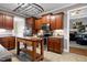 Kitchen featuring wood cabinets, stainless steel appliances and a wooden island at 5016 Swordfish Dr, Raleigh, NC 27603