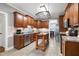 Spacious kitchen featuring stainless steel appliances, tile floors, and custom cabinets at 5016 Swordfish Dr, Raleigh, NC 27603