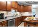 Kitchen featuring stainless steel appliances and wooden cabinets at 5016 Swordfish Dr, Raleigh, NC 27603