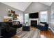 Comfortable living room featuring a fireplace and vaulted ceiling at 5016 Swordfish Dr, Raleigh, NC 27603
