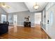 Open-concept living room featuring hardwood floors, vaulted ceilings, and natural light at 5016 Swordfish Dr, Raleigh, NC 27603