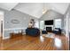 Bright living room showcasing a fireplace, hardwood floors and a vaulted ceiling at 5016 Swordfish Dr, Raleigh, NC 27603