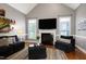 Cozy living room with vaulted ceiling, fireplace, and ample seating at 5016 Swordfish Dr, Raleigh, NC 27603