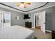 Spacious bedroom featuring a ceiling fan, en suite bathroom, and ample closet space at 5016 Swordfish Dr, Raleigh, NC 27603