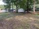 Large backyard with sheds, a trampoline, and mature trees at 503 Pine Run, Knightdale, NC 27545