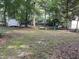 Expansive backyard featuring various recreational elements including play set and sheds at 503 Pine Run, Knightdale, NC 27545
