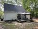Backyard with a deck, grill, a gazebo, and lush surroundings at 503 Pine Run, Knightdale, NC 27545