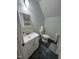 Cozy bathroom featuring a white vanity, toilet, and dark flooring at 503 Pine Run, Knightdale, NC 27545