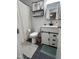 Stylish bathroom with white vanity, decorative mirror, and tiled floor at 503 Pine Run, Knightdale, NC 27545