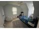 Playful bedroom with beanbag, colorful bedding, and neutral carpet at 503 Pine Run, Knightdale, NC 27545