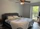 Bright bedroom with a large window, a cozy bed, and neutral decor at 503 Pine Run, Knightdale, NC 27545