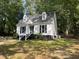 Charming home with a well-maintained front yard, white siding, and a welcoming front porch at 503 Pine Run, Knightdale, NC 27545