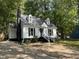 Well-maintained home with a long driveway and a traditional black and white color scheme at 503 Pine Run, Knightdale, NC 27545