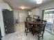 Eat-in kitchen with stainless steel appliances, bright white cabinets, and plenty of space at 503 Pine Run, Knightdale, NC 27545