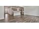 Open living space with a modern kitchen and seamless flow between living areas at 510 Resteasy Dr, Apex, NC 27539