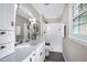Bright bathroom with a shower, a granite vanity, and upgraded fixtures at 5121 Raintree Rd, Durham, NC 27712