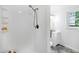 Bathroom with a walk-in shower, vanity, and natural light at 5121 Raintree Rd, Durham, NC 27712
