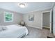 Comfortable bedroom with carpet flooring, natural light, and neutral paint at 5121 Raintree Rd, Durham, NC 27712