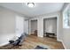 Spacious exercise room offers ample lighting, with wood floors, and storage closets at 5121 Raintree Rd, Durham, NC 27712
