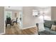 Inviting dining room with hardwood floors and a view through to a light-filled kitchen at 5121 Raintree Rd, Durham, NC 27712