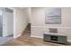 Inviting entryway with a staircase, storage bench, and access to the garage and basement at 5121 Raintree Rd, Durham, NC 27712