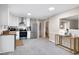 Open kitchen featuring modern appliances and lots of natural light at 5121 Raintree Rd, Durham, NC 27712