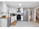 Modern kitchen with stainless appliances, subway tile backsplash and beautiful countertops at 5121 Raintree Rd, Durham, NC 27712