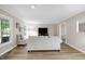 Inviting living room featuring hardwood floors, neutral paint and bright, natural light at 5121 Raintree Rd, Durham, NC 27712