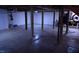 Unfinished basement with wooden support beams and concrete flooring at 515 Wildwood Dr, Durham, NC 27712