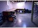 Unfinished basement featuring block walls, concrete floor, and a built-in workbench at 515 Wildwood Dr, Durham, NC 27712