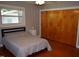 Bedroom with a bed, wood floors, and closet, offering a comfortable and functional space at 515 Wildwood Dr, Durham, NC 27712