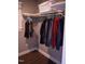 Corner view of a closet with rods for hanging clothes and a top shelf for extra storage at 515 Wildwood Dr, Durham, NC 27712