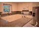 Charming kitchen featuring granite countertops and white cabinets at 515 Wildwood Dr, Durham, NC 27712