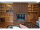 Spacious living room featuring a brick fireplace, built-in shelves and cabinets at 515 Wildwood Dr, Durham, NC 27712