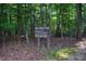 Eno River Park sign surrounded by lush foliage at 515 Wildwood Dr, Durham, NC 27712