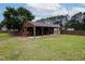 Large barn with multiple stalls, mature trees and lush green lawn at 5200 Pulley Town Rd, Zebulon, NC 27597