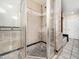 Shower room with full tile surround, glass door and floor drain at 5200 Pulley Town Rd, Zebulon, NC 27597