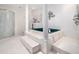 Elegant bathroom with a raised jacuzzi tub, separate shower and vintage columns at 5200 Pulley Town Rd, Zebulon, NC 27597