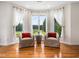 Seating area with wood floors, big windows and outdoor views at 5200 Pulley Town Rd, Zebulon, NC 27597