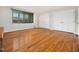 Inviting bedroom featuring hardwood floors, natural light from a window, and double closets at 5200 Pulley Town Rd, Zebulon, NC 27597