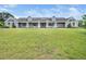 Exterior view of home with covered porch and well-manicured green yard, offering curb appeal at 5200 Pulley Town Rd, Zebulon, NC 27597