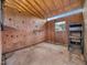 Spacious horse stall featuring plywood walls and convenient rack for storage at 5200 Pulley Town Rd, Zebulon, NC 27597