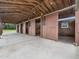 Well-maintained horse stalls, ideal for equestrian enthusiasts, with sliding doors and concrete flooring at 5200 Pulley Town Rd, Zebulon, NC 27597