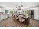 Bright kitchen featuring white cabinets, stainless steel appliances, granite countertops, a center island, and a window view at 5200 Pulley Town Rd, Zebulon, NC 27597