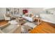 Bright living room featuring hardwood floors, neutral furniture, and stylish decor, creating a cozy and inviting space at 5200 Pulley Town Rd, Zebulon, NC 27597