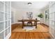 Bright office space with a large wooden desk, neutral walls, and natural light, perfect for a productive work environment at 5200 Pulley Town Rd, Zebulon, NC 27597