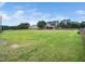 Expansive grassy property featuring a horse barn and fenced perimeter, providing a serene, rural atmosphere at 5200 Pulley Town Rd, Zebulon, NC 27597