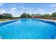 Sparkling in-ground swimming pool, perfect for relaxation and outdoor enjoyment on a sunny day at 5200 Pulley Town Rd, Zebulon, NC 27597